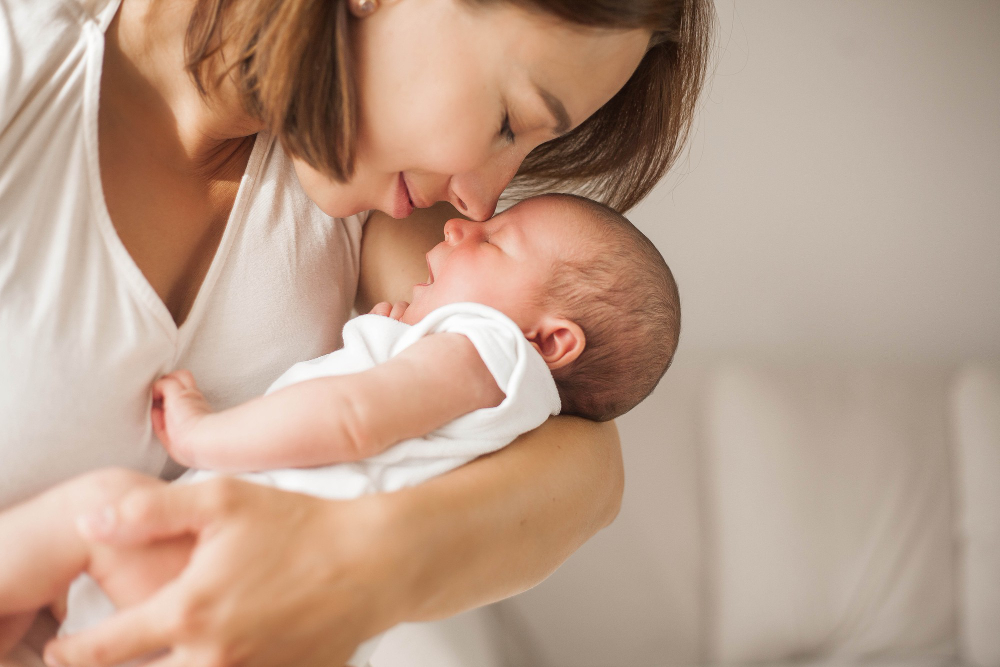 Image of a mom holding a newborn baby