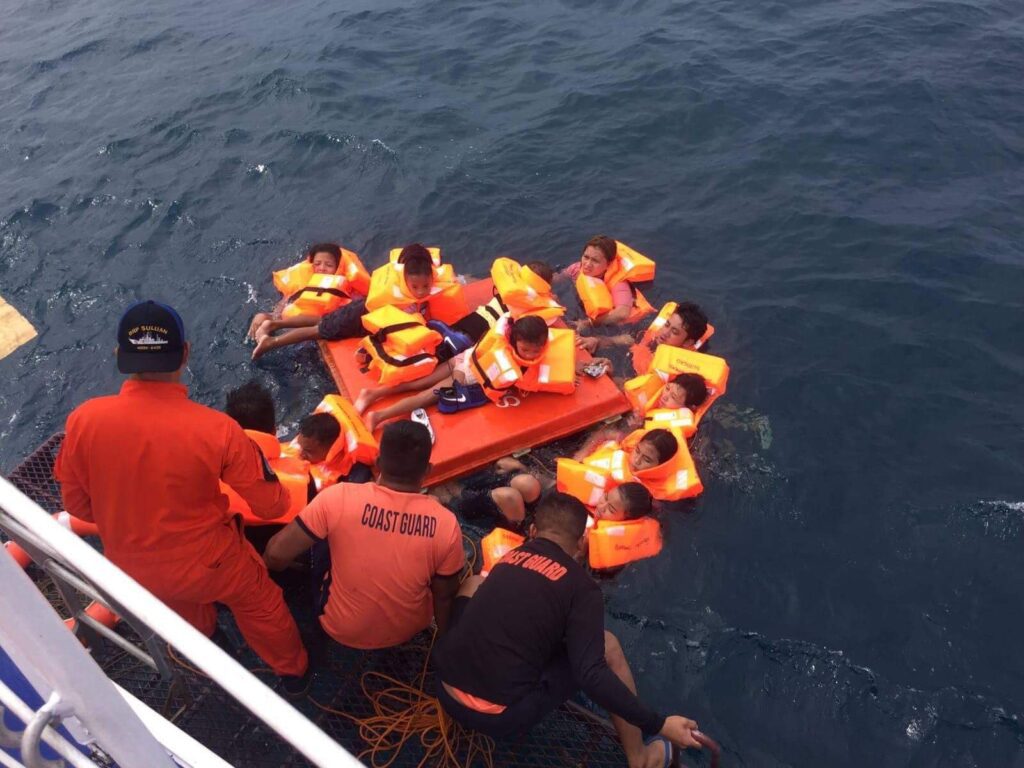 Philippine Coast Guard rescuers retrieving survivors from the M/V Siargao Princess sinking in 2019