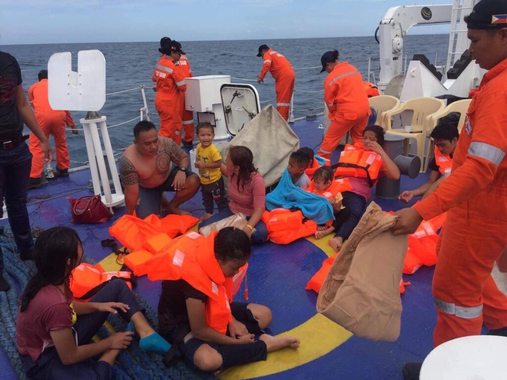 Ralph Barajan with survivors of the M/V Siargao Princess sinking after rescue
