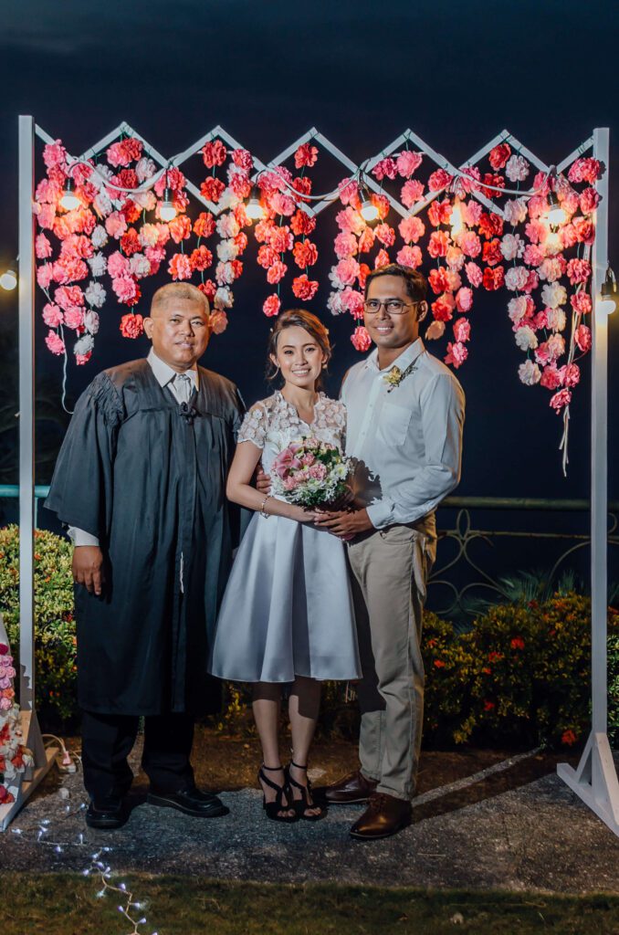 Adrienne and Jan Ray Rulida with their officiator, Judge Raul Barbarona, at their civil wedding