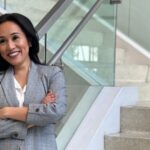 Dr. Kathleen Besas, Filipina-American nurse and founder of She is Rooted and Rising, posing confidently in Los Angeles.