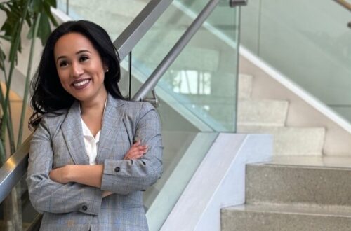 Dr. Kathleen Besas, Filipina-American nurse and founder of She is Rooted and Rising, posing confidently in Los Angeles.